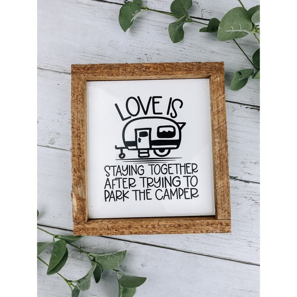 love is staying together after trying to park the camper sign