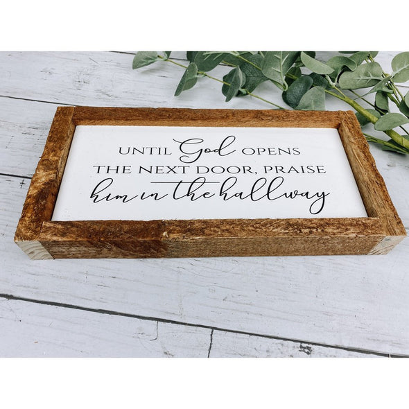 until god opens the next door praise him in the hallway sign