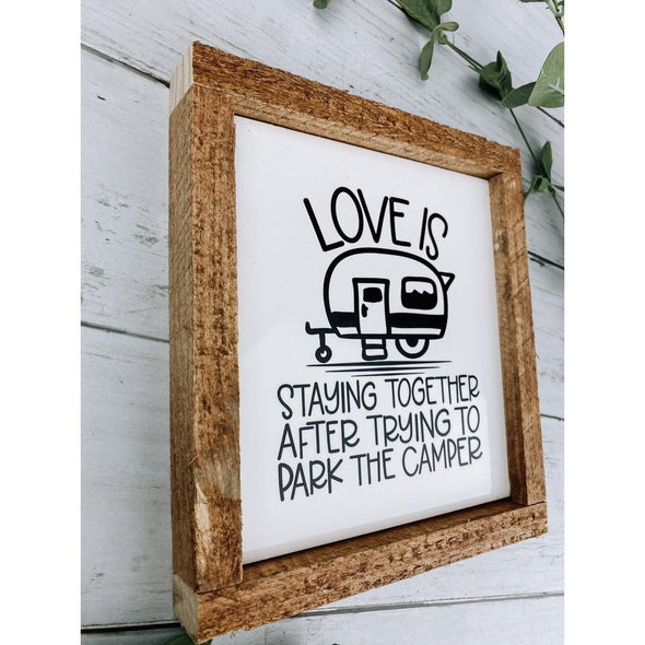 love is staying together after trying to park the camper sign