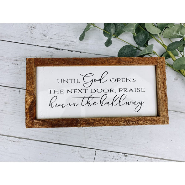 until god opens the next door praise him in the hallway sign