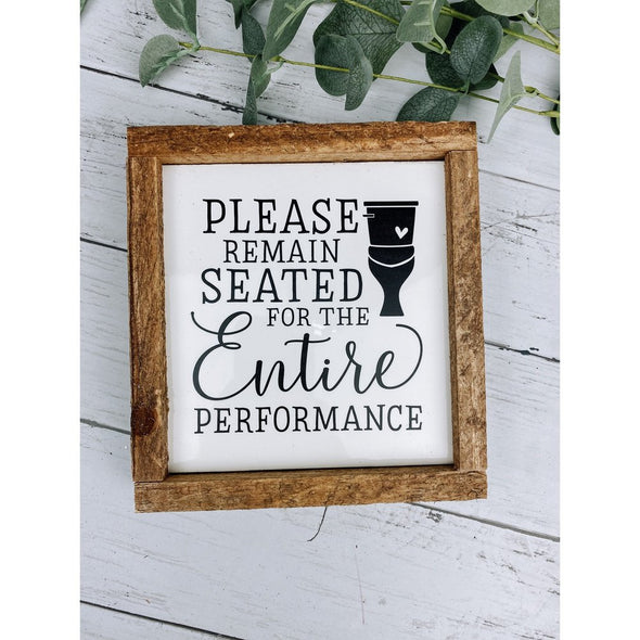 please remain seated for the entire performance sign
