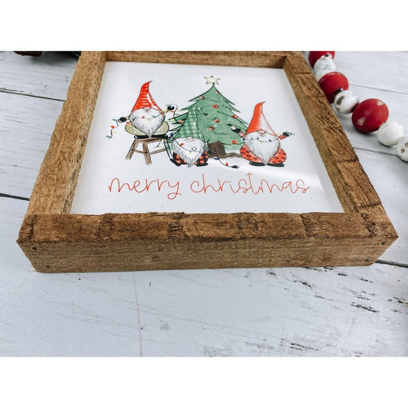 merry christmas with three gnomes and a tree sign